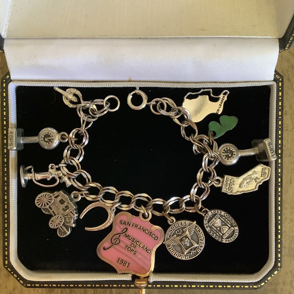 Vintage Tops silver tone charm bracelet.